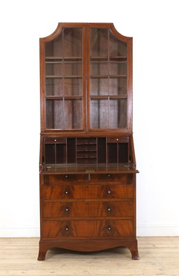 Lot 140 - An Heal's & Co. mahogany bureau bookcase