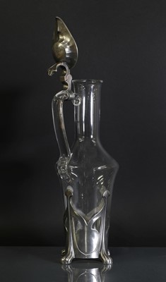 Lot 85 - An Art Nouveau pewter and glass claret jug