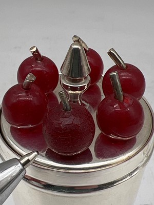 Lot 110 - A silver-plated cocktail stick, measure and funnel by P H Vogel