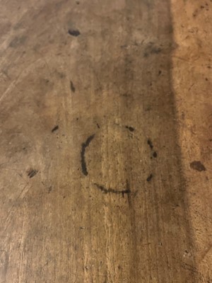 Lot 49 - A walnut and wrought iron table