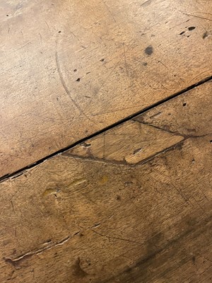 Lot 49 - A walnut and wrought iron table