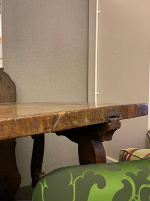 Lot 49 - A walnut and wrought iron table