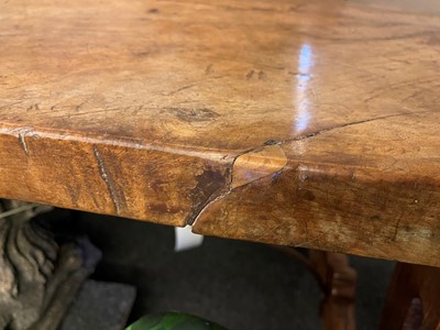Lot 49 - A walnut and wrought iron table