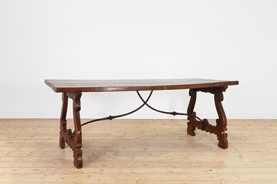 Lot 49 - A walnut and wrought iron table