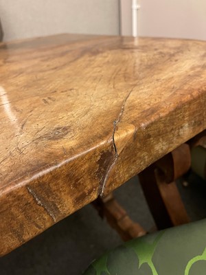 Lot 49 - A walnut and wrought iron table
