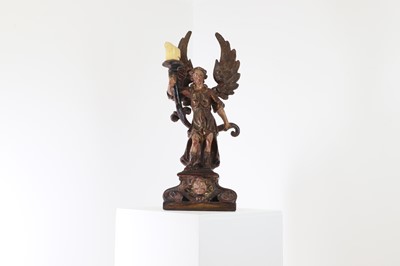 Lot 5 - A carved and polychrome painted candleholder