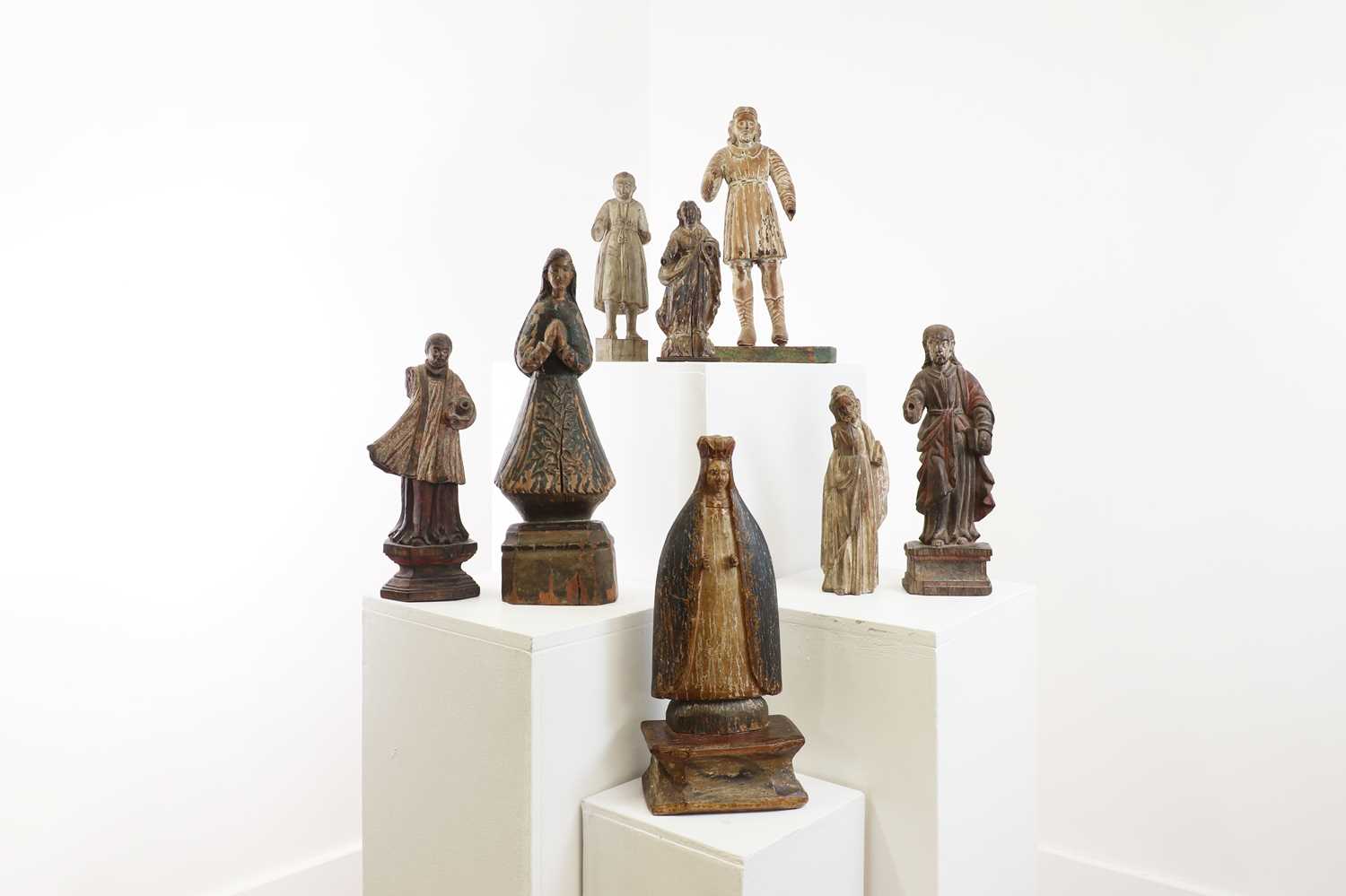 Lot 14 - A group of carved and polychrome-painted wooden saints