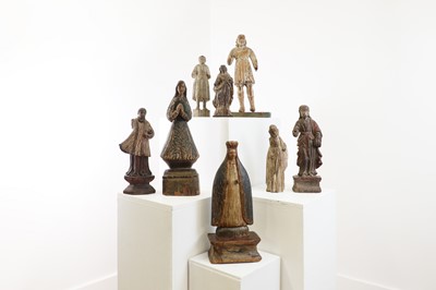 Lot 14 - A group of carved and polychrome-painted wooden saints