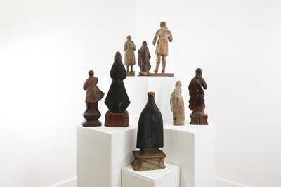 Lot 14 - A group of carved and polychrome-painted wooden saints