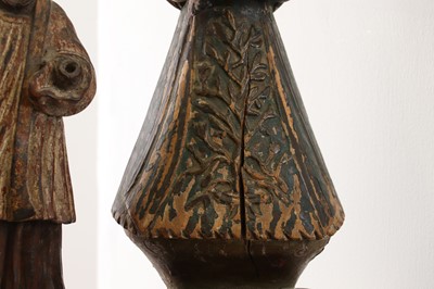 Lot 14 - A group of carved and polychrome-painted wooden saints