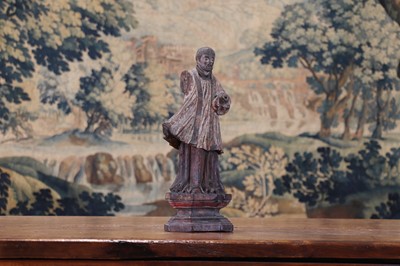 Lot 14 - A group of carved and polychrome-painted wooden saints