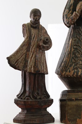Lot 14 - A group of carved and polychrome-painted wooden saints