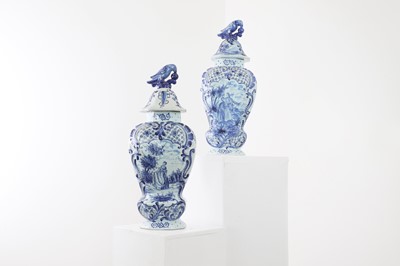 Lot 38 - A pair of tin-glazed earthenware vases and covers