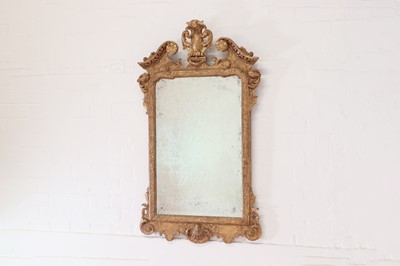 Lot 29 - A George II carved giltwood and gesso pier mirror