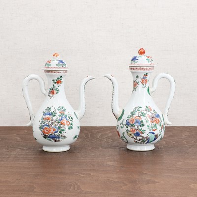 Lot 82 - A pair of Chinese wucai ewers and covers