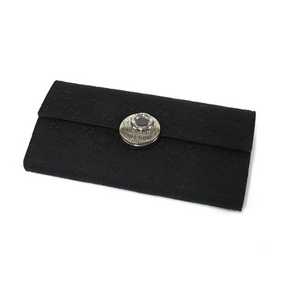 Lot 337 - A Gucci black canvas purse