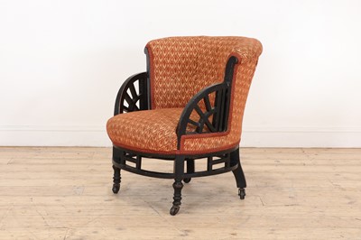 Lot 11 - An ebonised armchair