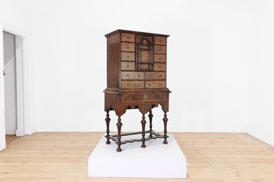 Lot 351 - A yew wood and walnut cabinet on stand