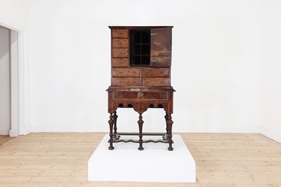 Lot 351 - A yew wood and walnut cabinet on stand