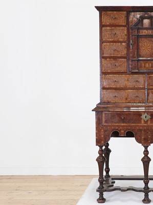 Lot 351 - A yew wood and walnut cabinet on stand
