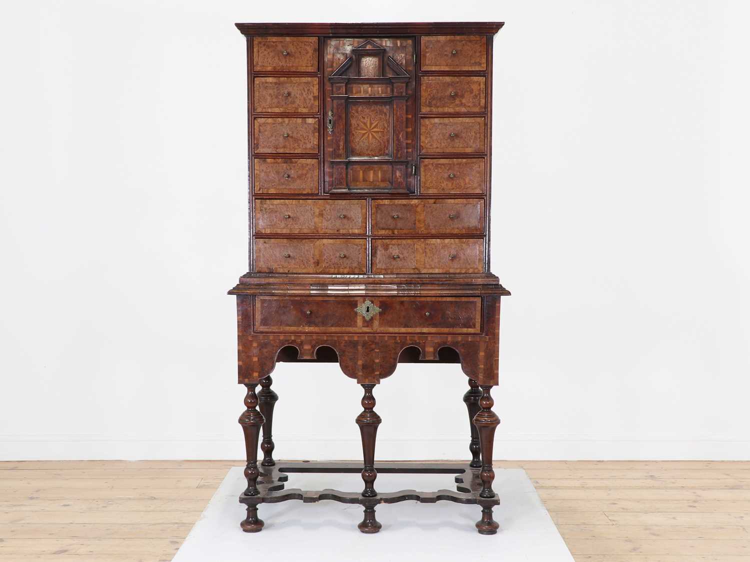 Lot 351 - A yew wood and walnut cabinet on stand