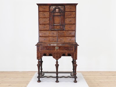Lot 351 - A yew wood and walnut cabinet on stand