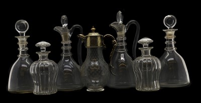 Lot 281 - A pair of Regency clear glass claret jugs