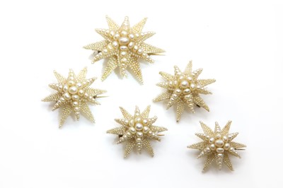Lot 12 - A set of five graduated mid 19th century pearl and seed pearl star brooches