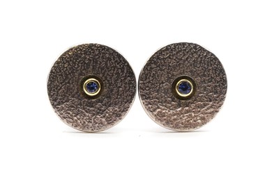 Lot 139 - A pair of sterling silver sapphire set cufflinks