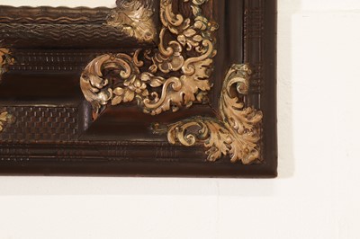 Lot 106 - An ebonised fruitwood mirror