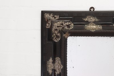 Lot 106 - An ebonised fruitwood mirror