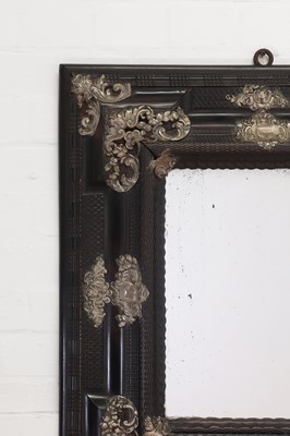 Lot 106 - An ebonised fruitwood mirror