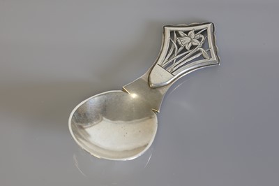 Lot 115 - An Arts & Crafts silver caddy spoon