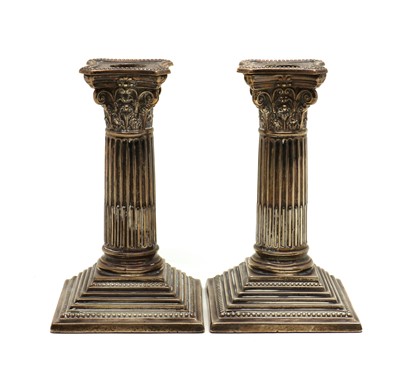 Lot 34 - A pair of Edwardian silver candlesticks