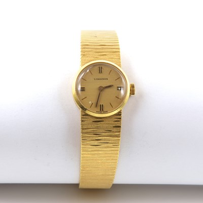 Lot 554 - A ladies' 18ct gold Longines mechanical bracelet watch