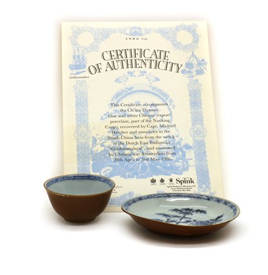 Lot 86 - A Chinese Nanking Cargo blue and white porcelain tea bowl and saucer