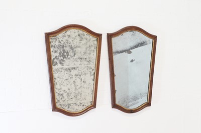 Lot 296 - A pair of walnut and parcel-gilt mirrors