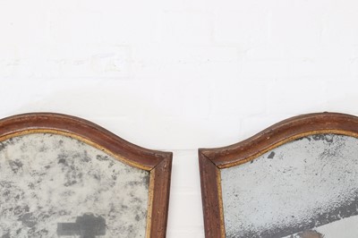 Lot 296 - A pair of walnut and parcel-gilt mirrors