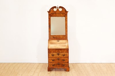 Lot 381 - A small George I-style walnut bureau bookcase