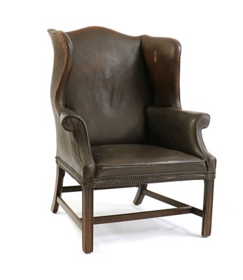 Lot 444 - A George III-style wingback armchair