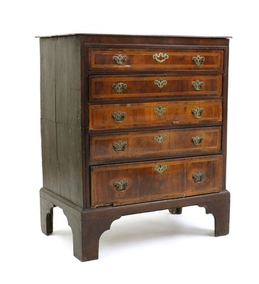 Lot 457 - A provincial oak and walnut chest of drawers