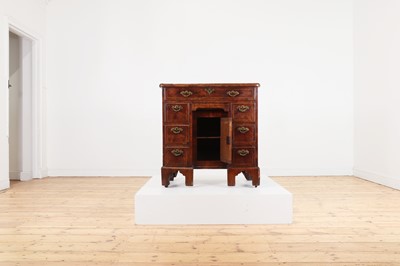 Lot 34 - A George II walnut and feather-banded kneehole desk