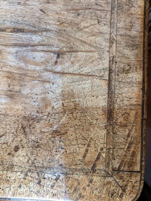 Lot 34 - A George II walnut and feather-banded kneehole desk