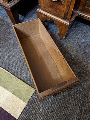 Lot 34 - A George II walnut and feather-banded kneehole desk