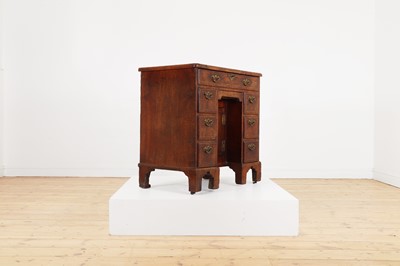 Lot 34 - A George II walnut and feather-banded kneehole desk