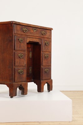 Lot 34 - A George II walnut and feather-banded kneehole desk