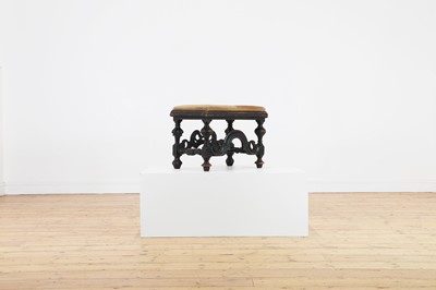 Lot 372 - An ebonised walnut stool