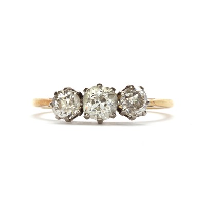 Lot 66 - A gold three stone diamond ring