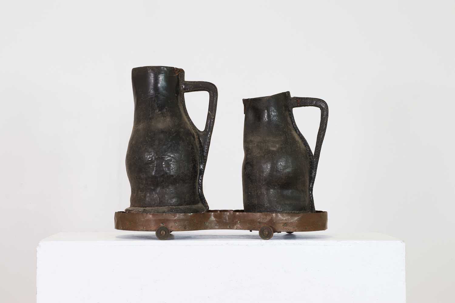 Lot 379 - Two large leather flagons or blackjacks