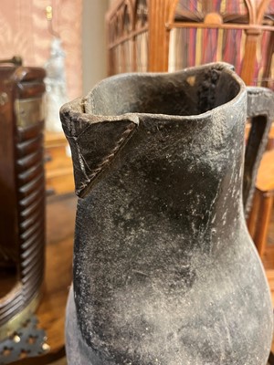 Lot 379 - Two large leather flagons or blackjacks